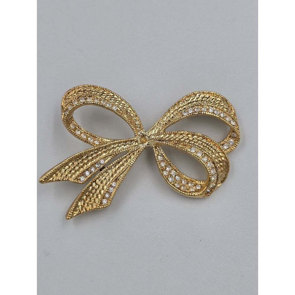 Vintage Roman Gold Tone Bow Brooch Pin‎ with Clear Rhinestones Textured Design